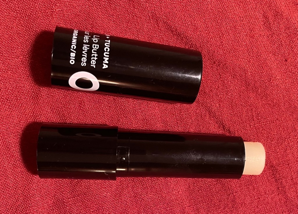 Photo of open tube of Om Argan + Tucuma Lip Butter.